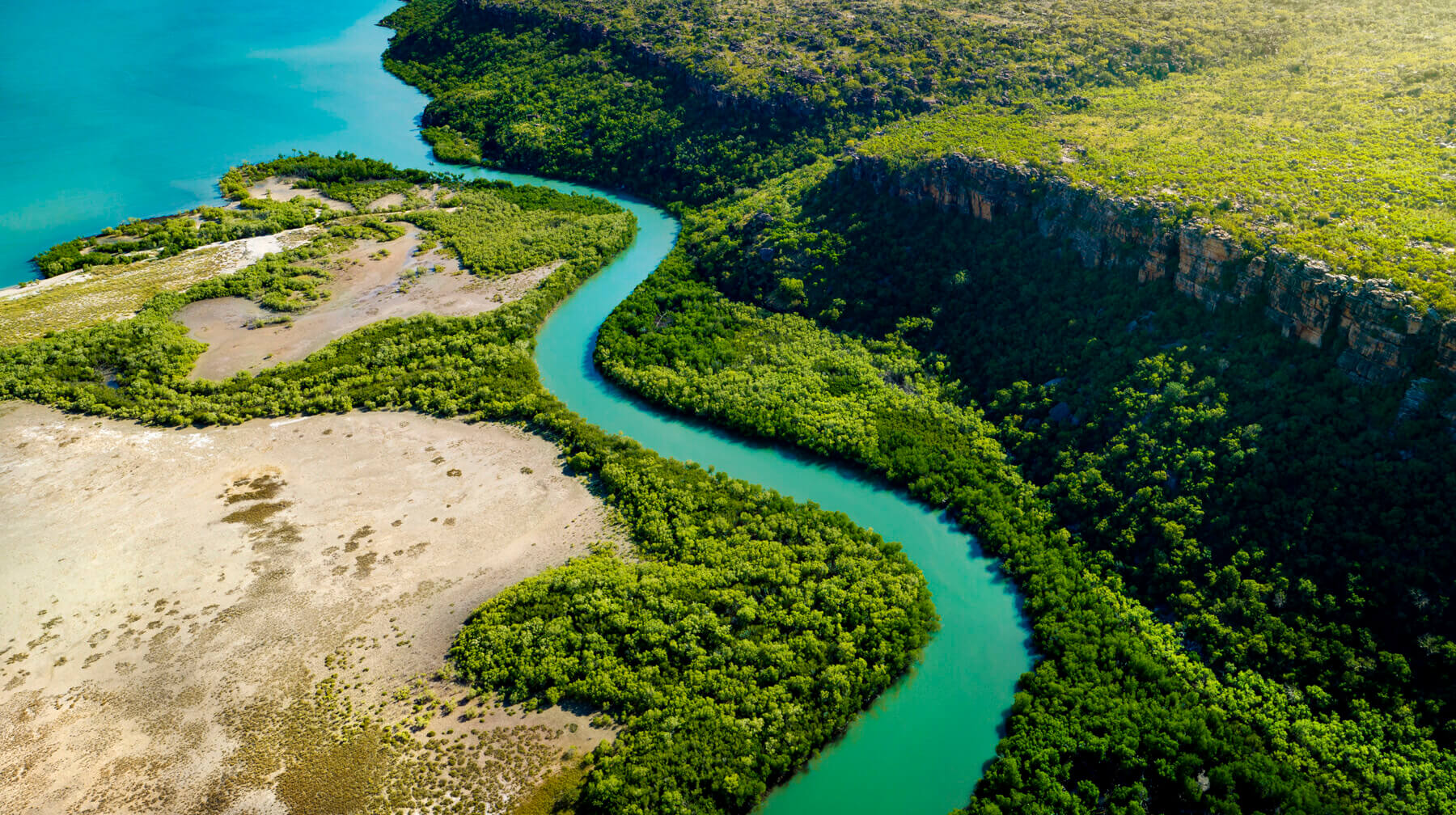 Aerial view of a Kimberley river and tree lined banks