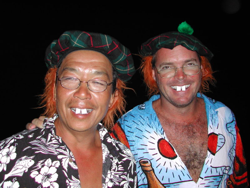 Two men in costumes with buck teeth
