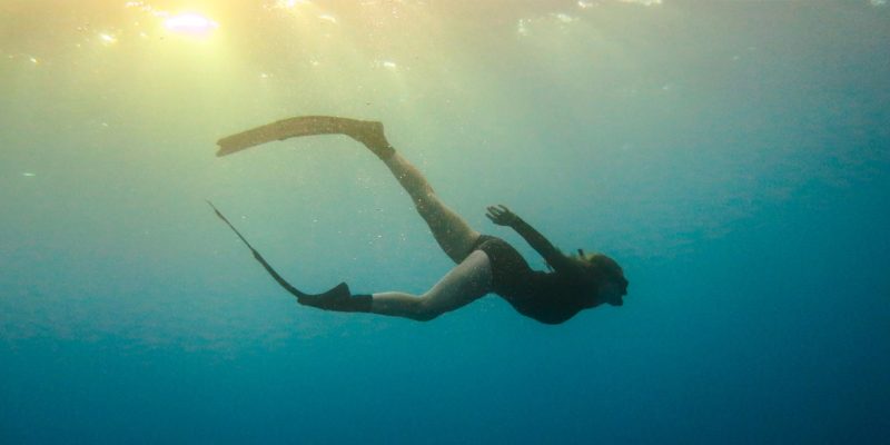 Silhouette of woman snorkelling, Rowley Shoals
