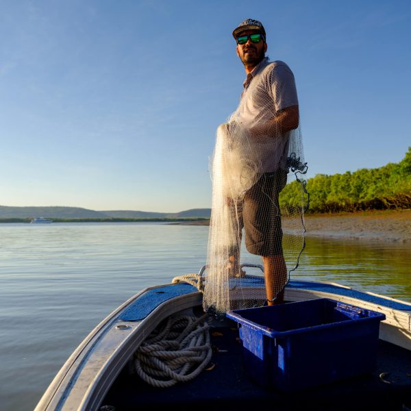 Casting out a net of a Great Escape Cruises boat